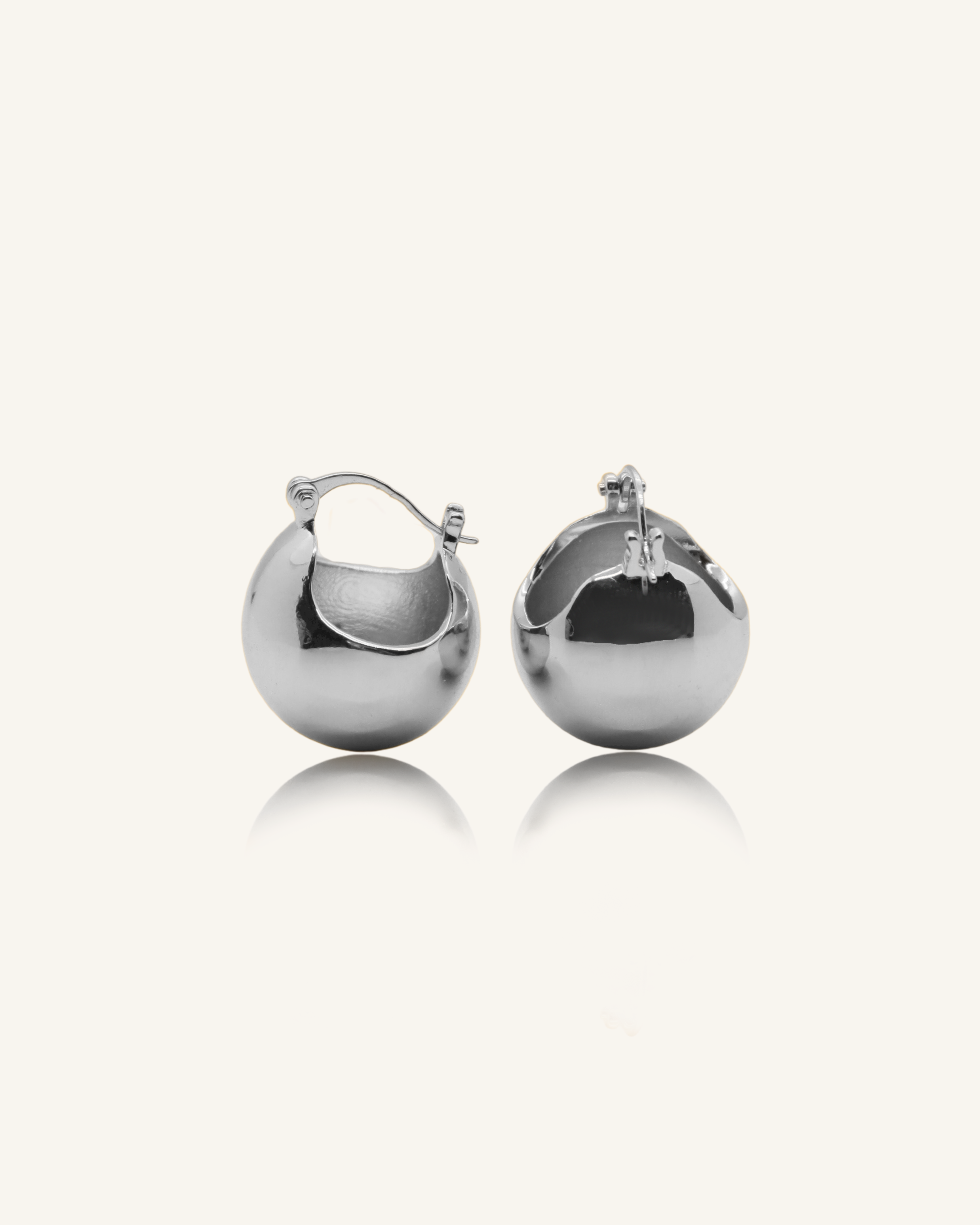 Maeve Earrings in silver with a bold dome design and polished finish.