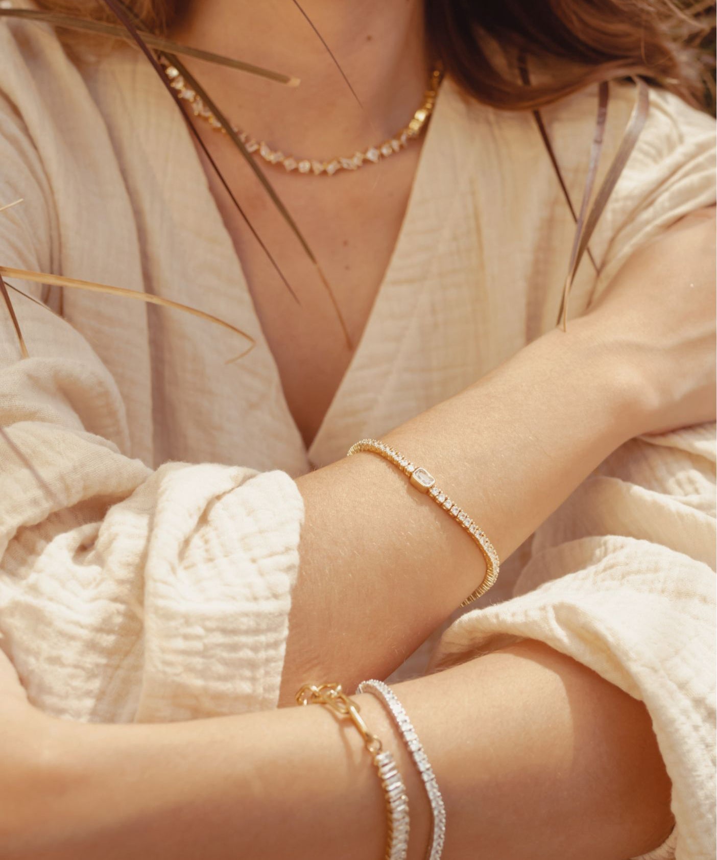Closeup of gold Malvi Bracelet highlighting shimmering centerpiece.