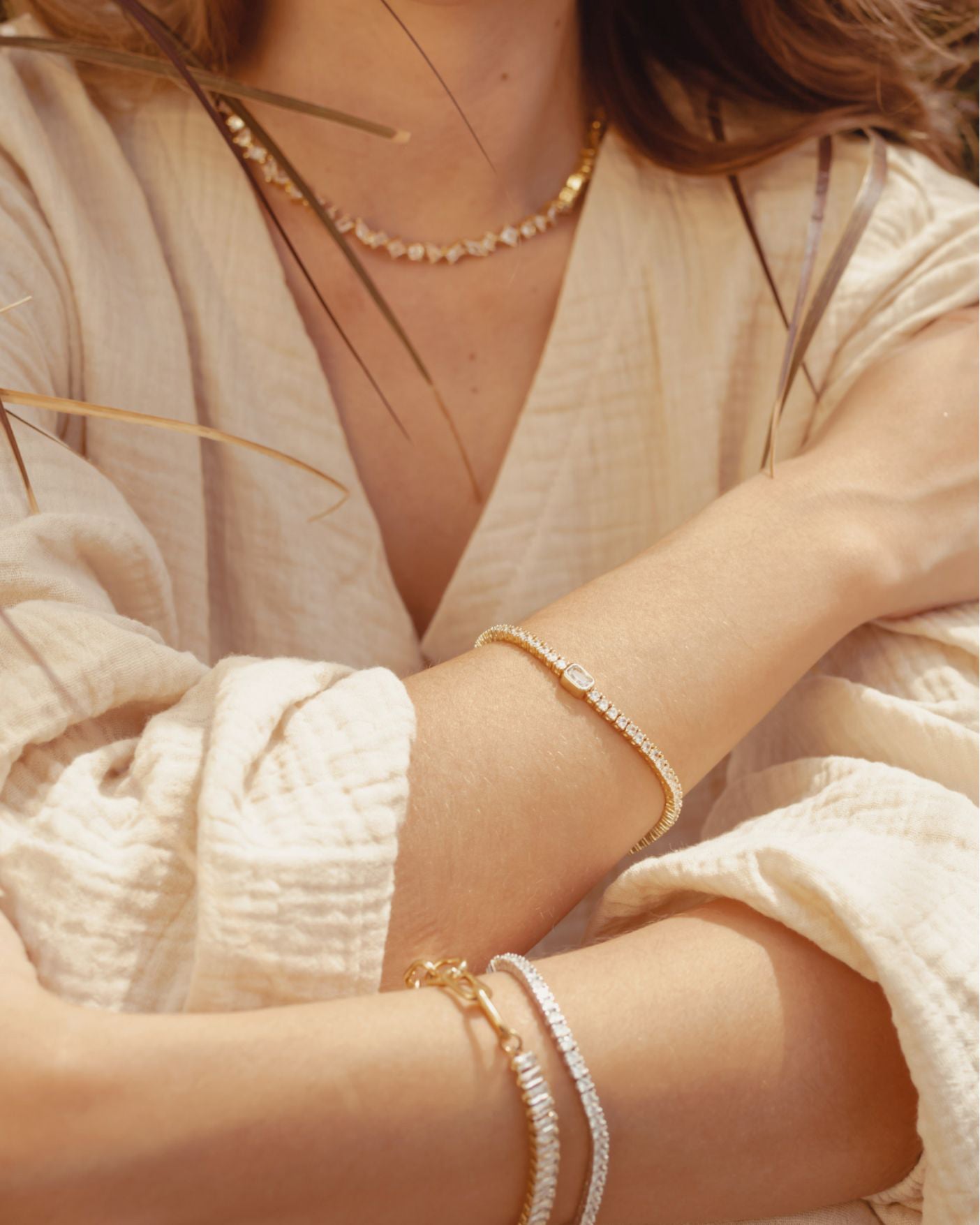 Closeup of gold Malvi Bracelet highlighting shimmering centerpiece.