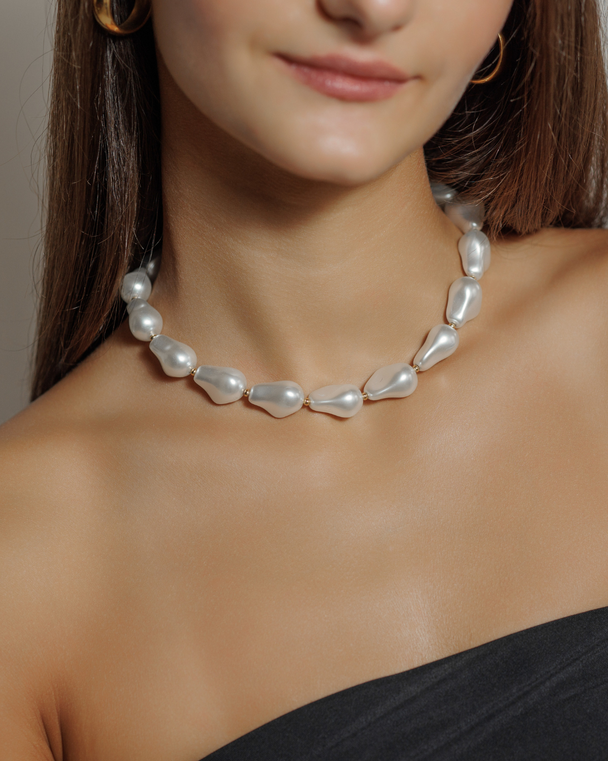 Close-up of the Margaret Necklace worn on neck, highlighting pearl and gold detail.