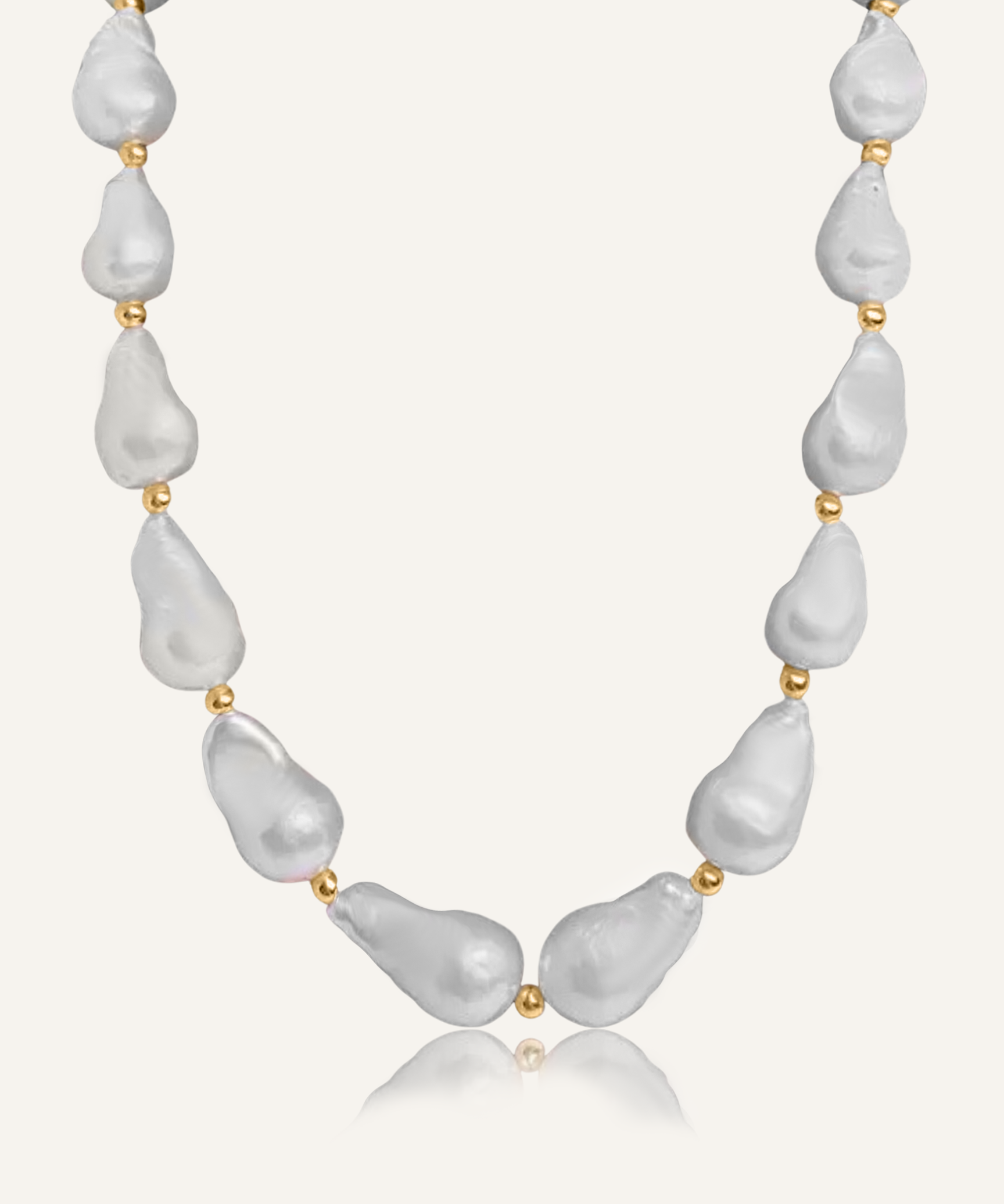Product flatlay of the Margaret Necklace showcasing baroque pearls and gold bead accents.