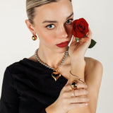 Margaux Necklace paired with the Love Bracelet for a coordinated heart-themed jewelry look.