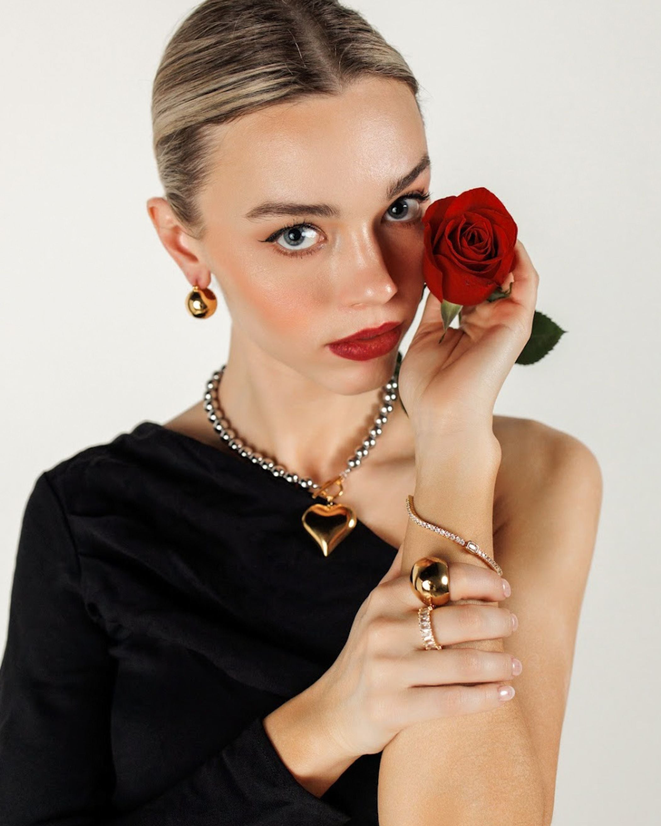 Margaux Necklace paired with the Love Bracelet for a coordinated heart-themed jewelry look.