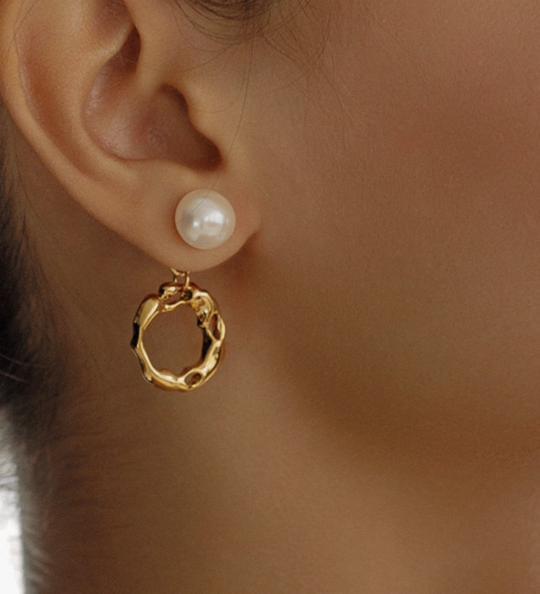 Close-up of Maria Earrings worn, highlighting pearl and gold hoop detail.