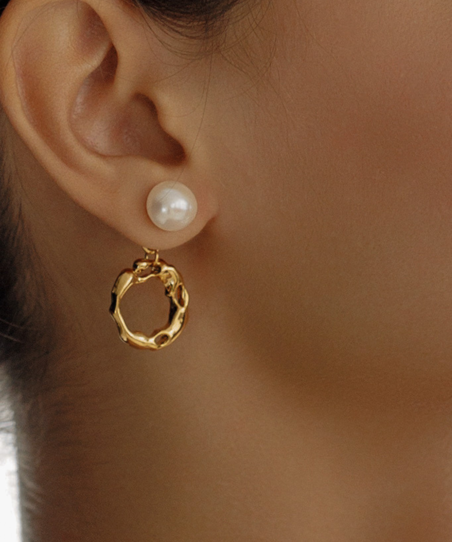 Close-up of Maria Earrings worn, highlighting pearl and gold hoop detail.