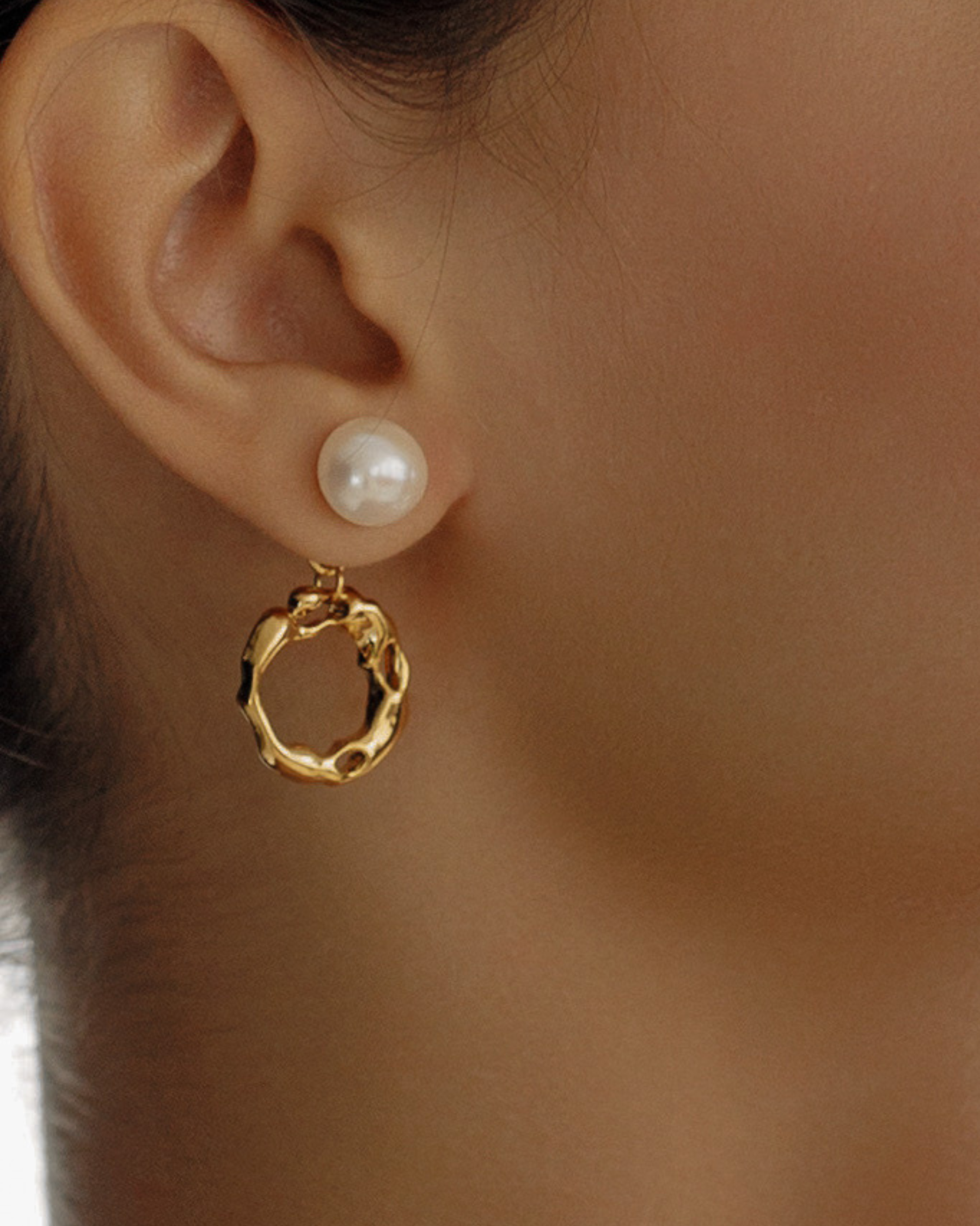 Close-up of Maria Earrings worn, highlighting pearl and gold hoop detail.