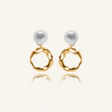 Maria Earrings featuring gold irregular hoops and freshwater pearl drops.