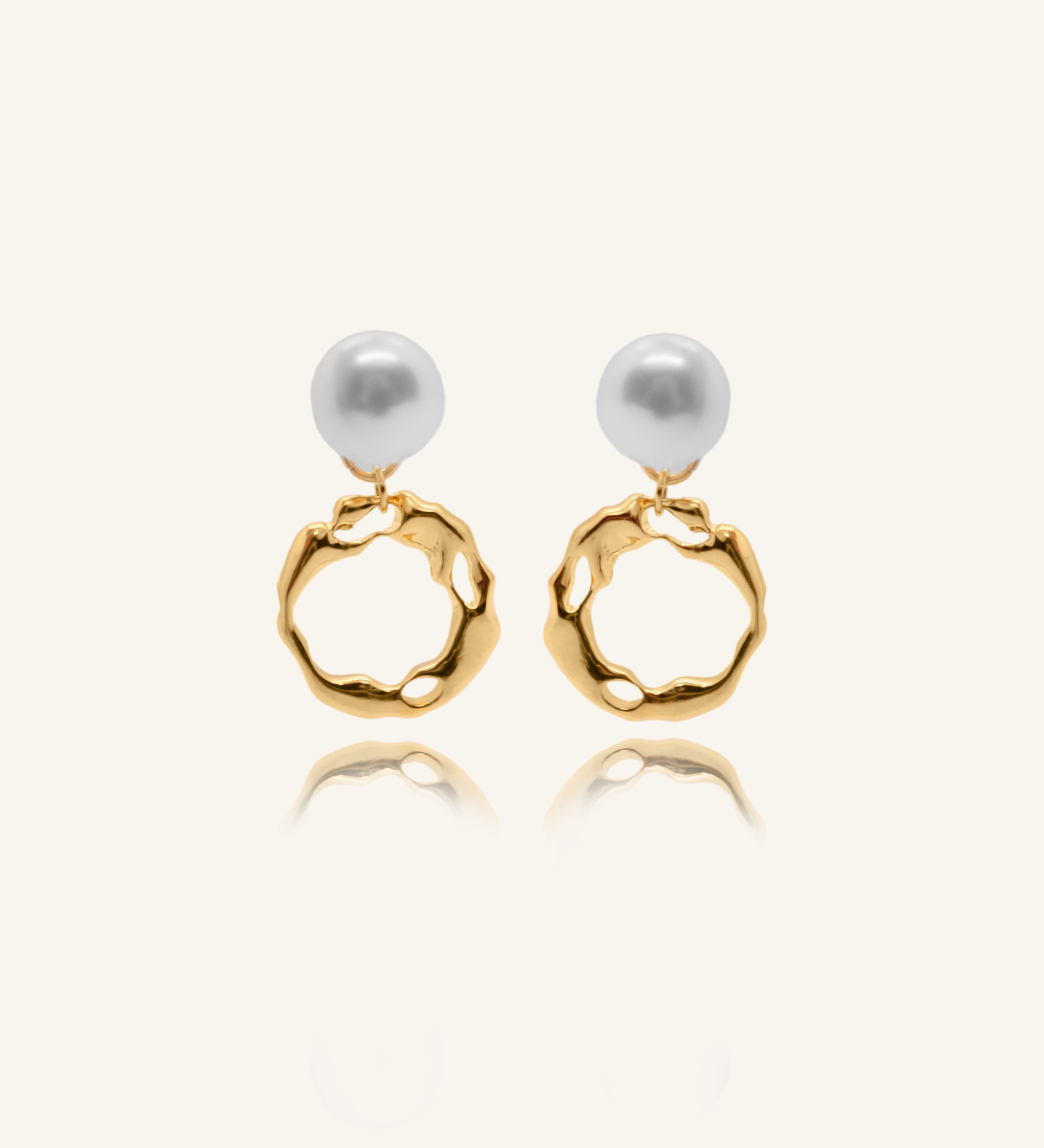 Maria Earrings featuring gold irregular hoops and freshwater pearl drops.