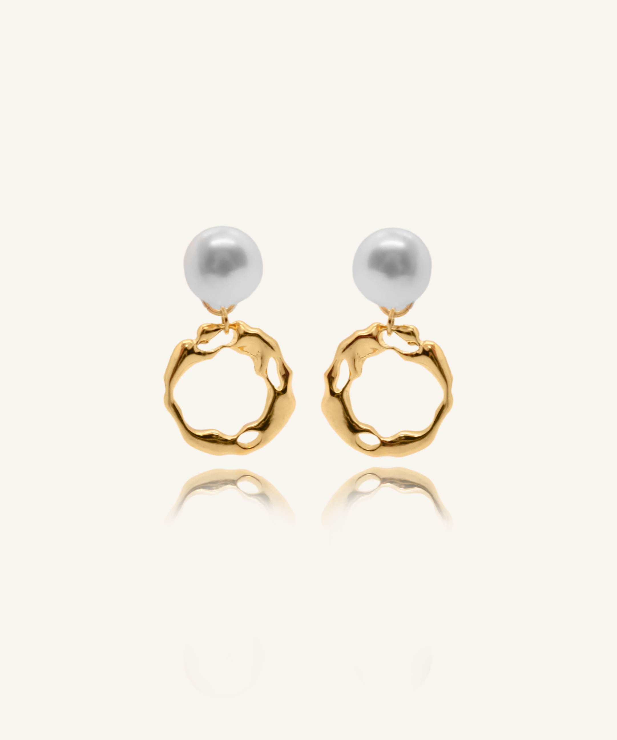 Maria Earrings featuring gold irregular hoops and freshwater pearl drops.
