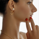 Maria Earrings shown from the side on model, showcasing dangle style.