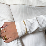 Model styling Mira Bracelet with a minimalist outfit for a chic everyday look.