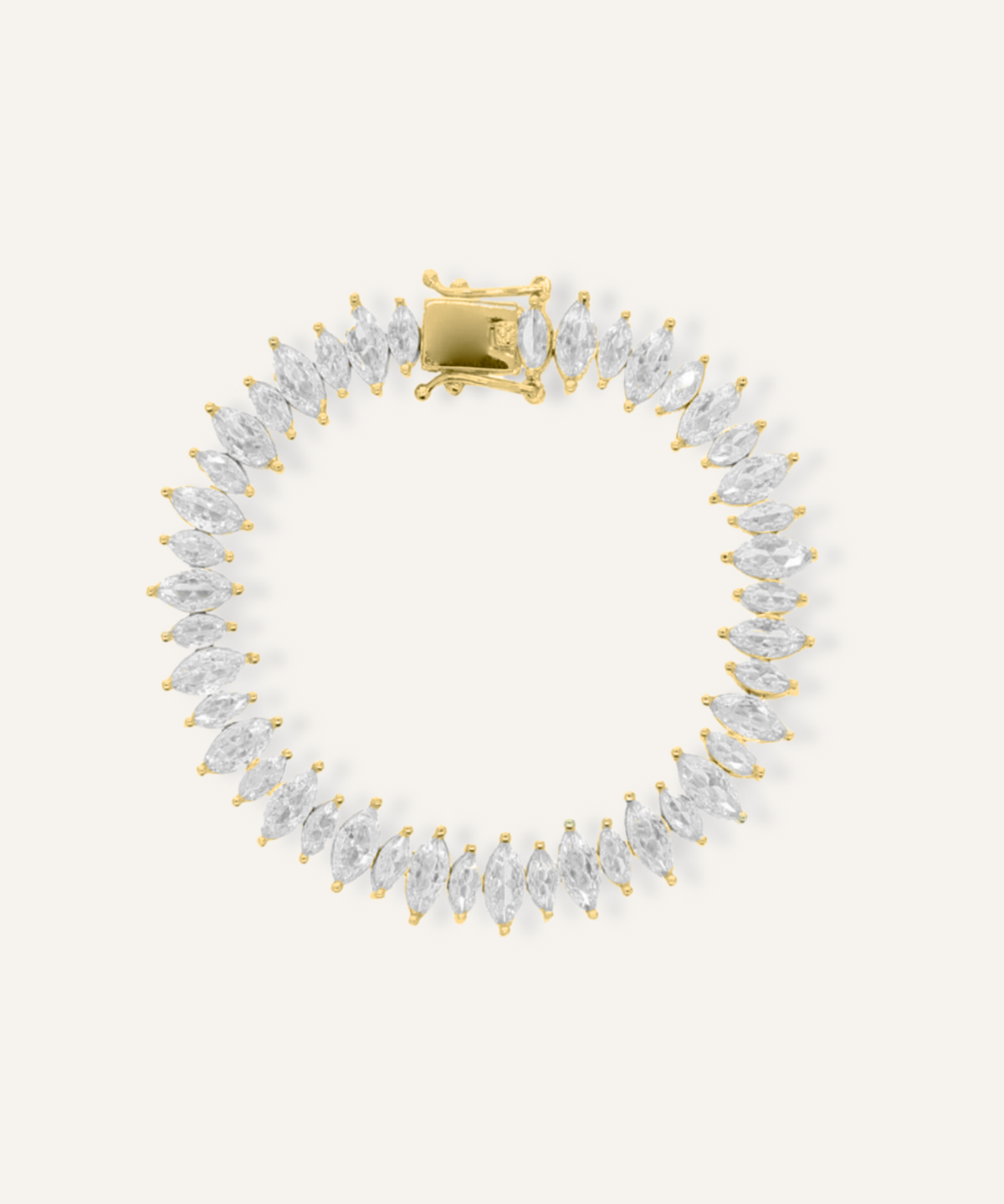 Flatlay of Naomi Bracelet in gold with horse eye zirconia stones and tennis chain.