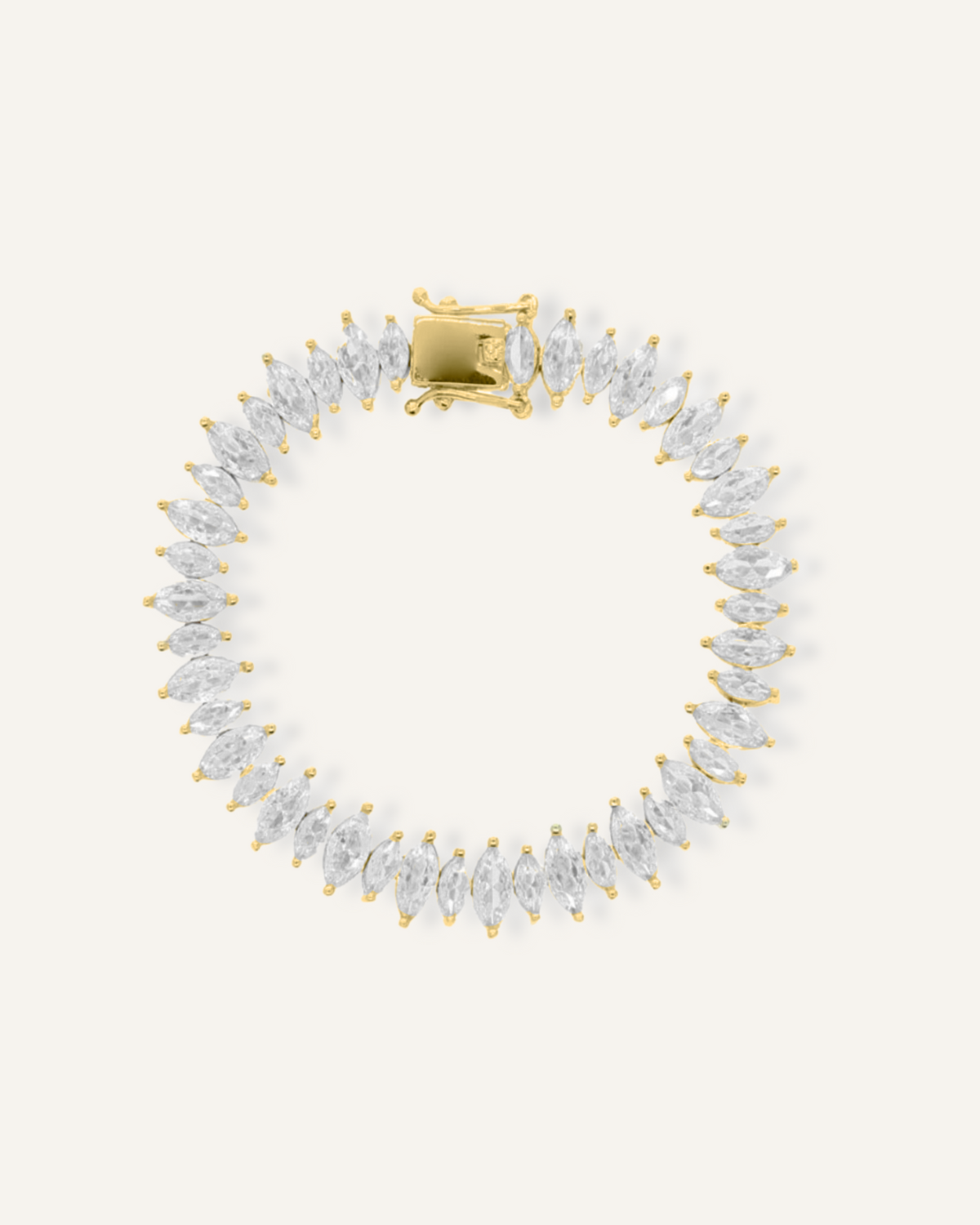 Flatlay of Naomi Bracelet in gold with horse eye zirconia stones and tennis chain.