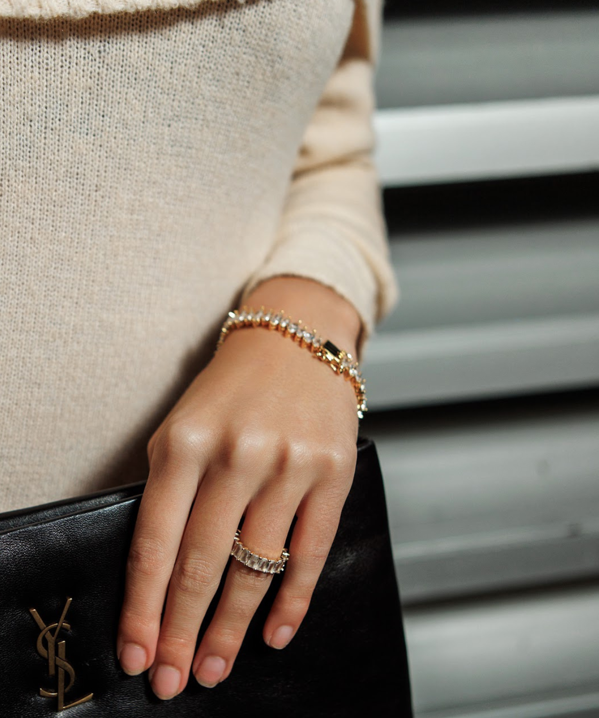 Model wearing the Naomi Bracelet in gold, showcasing the elegant zirconia sparkle.