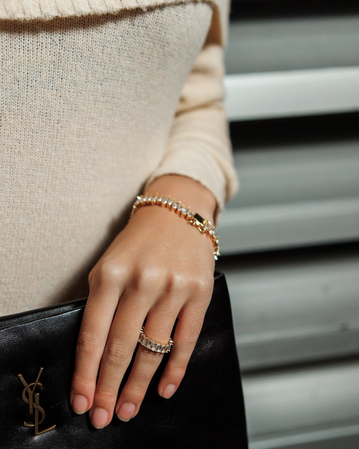 Model wearing the Naomi Bracelet in gold, showcasing the elegant zirconia sparkle.