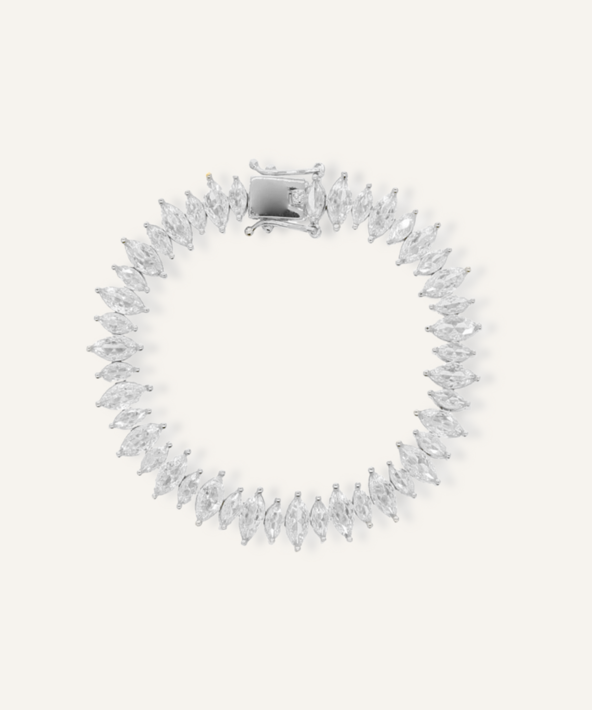 Flatlay of Naomi Bracelet in silver with horse eye zirconia stones and tennis chain design.