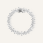 Flatlay of Naomi Bracelet in silver with horse eye zirconia stones and tennis chain design.