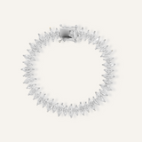 Flatlay of Naomi Bracelet in silver with horse eye zirconia stones and tennis chain design.