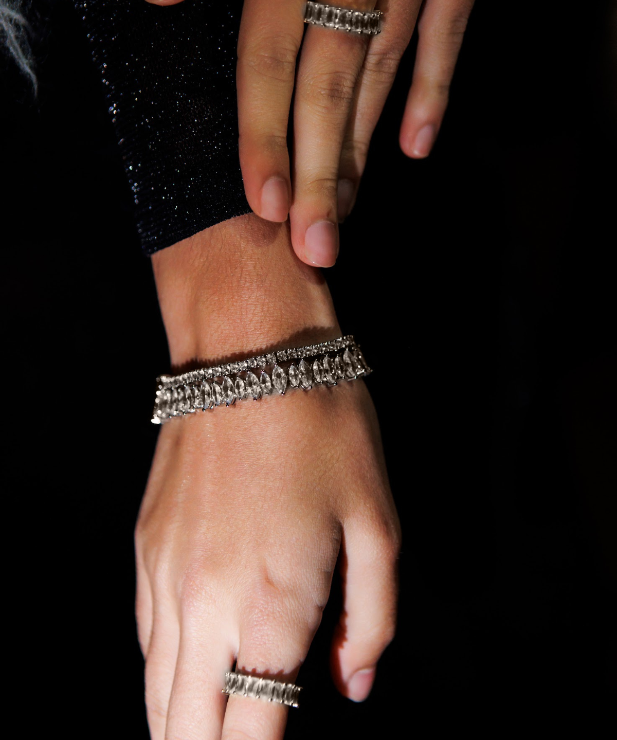 Model wearing the Naomi Bracelet in silver, highlighting the shimmering zirconia stones.