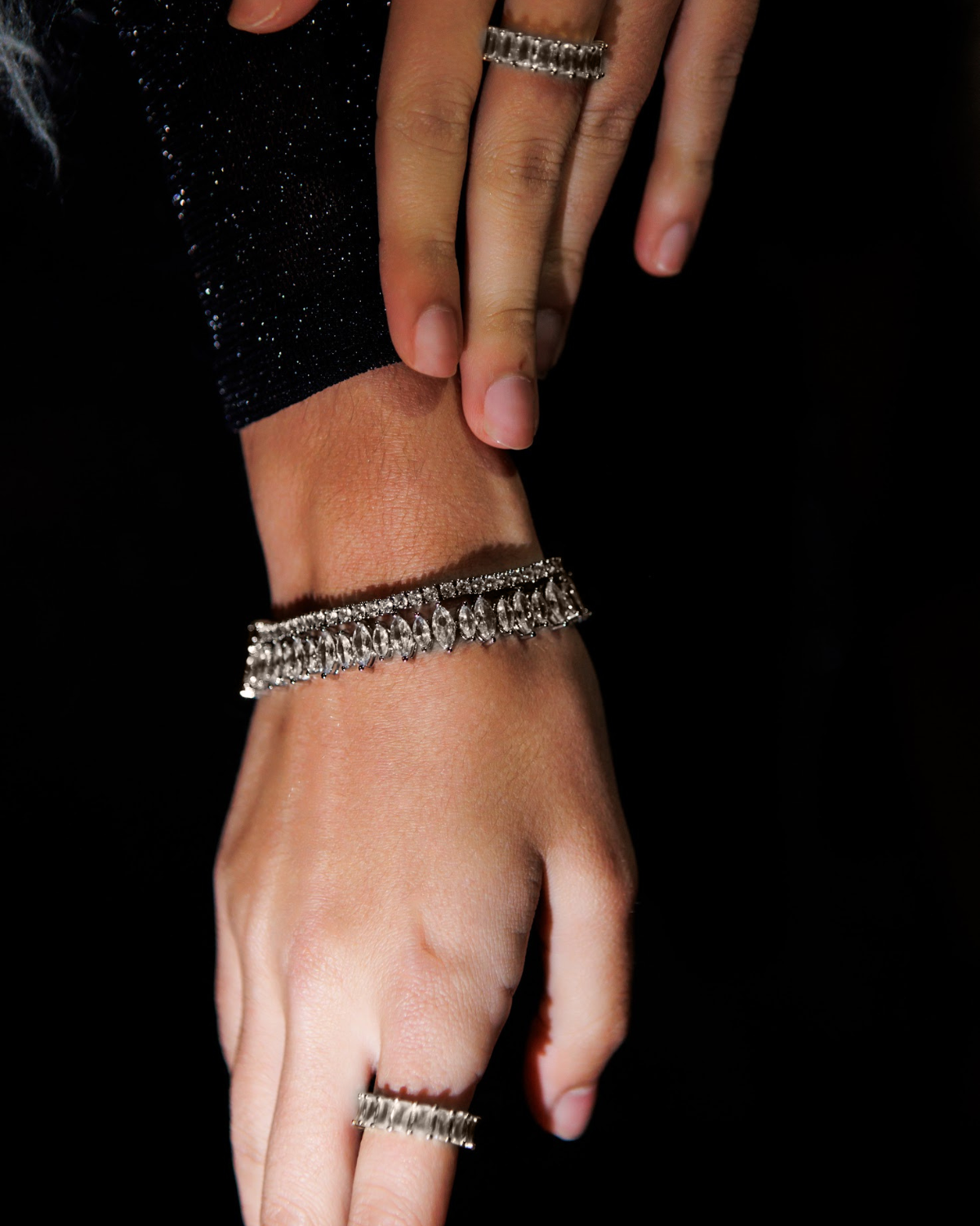 Model wearing the Naomi Bracelet in silver, highlighting the shimmering zirconia stones.