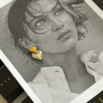 Elegant gold and silver Sadie Earrings styled for a romantic evening look.
