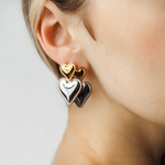 Profile view of Sadie Earrings with two-tone heart elements.