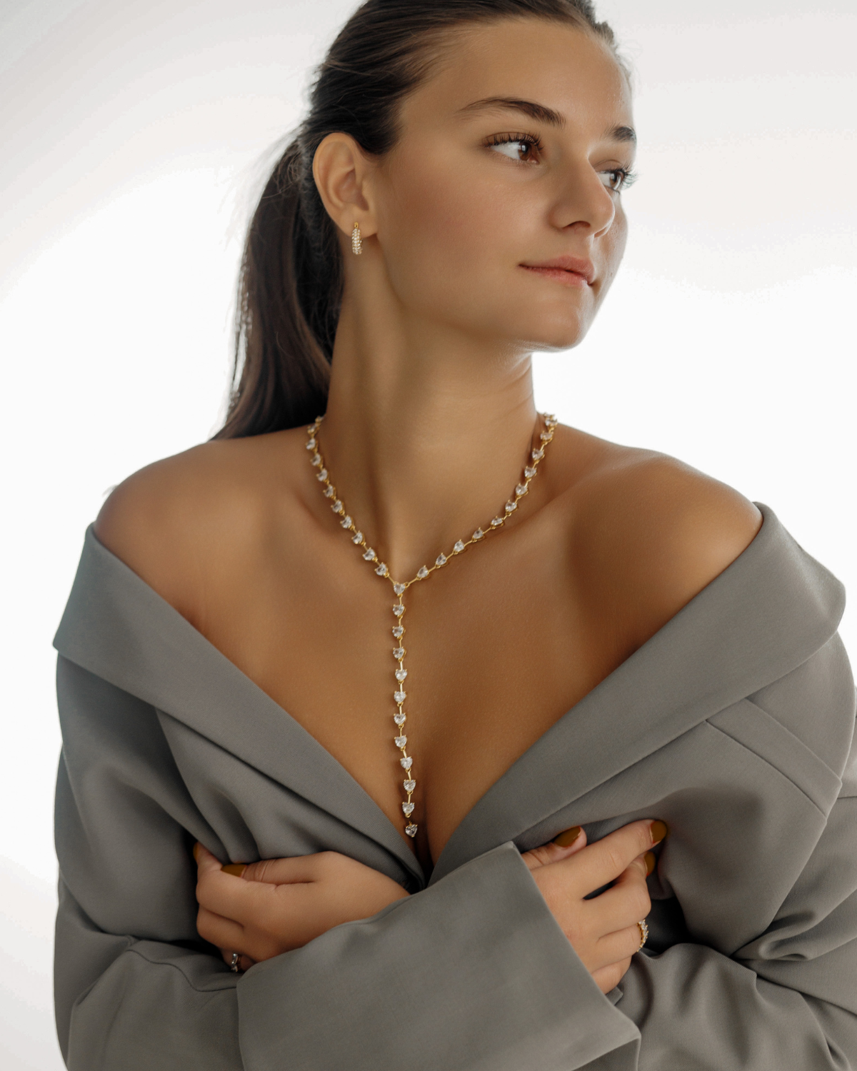 Seraphine Necklace in gold styled for a special occasion, showing the full Y-drop.