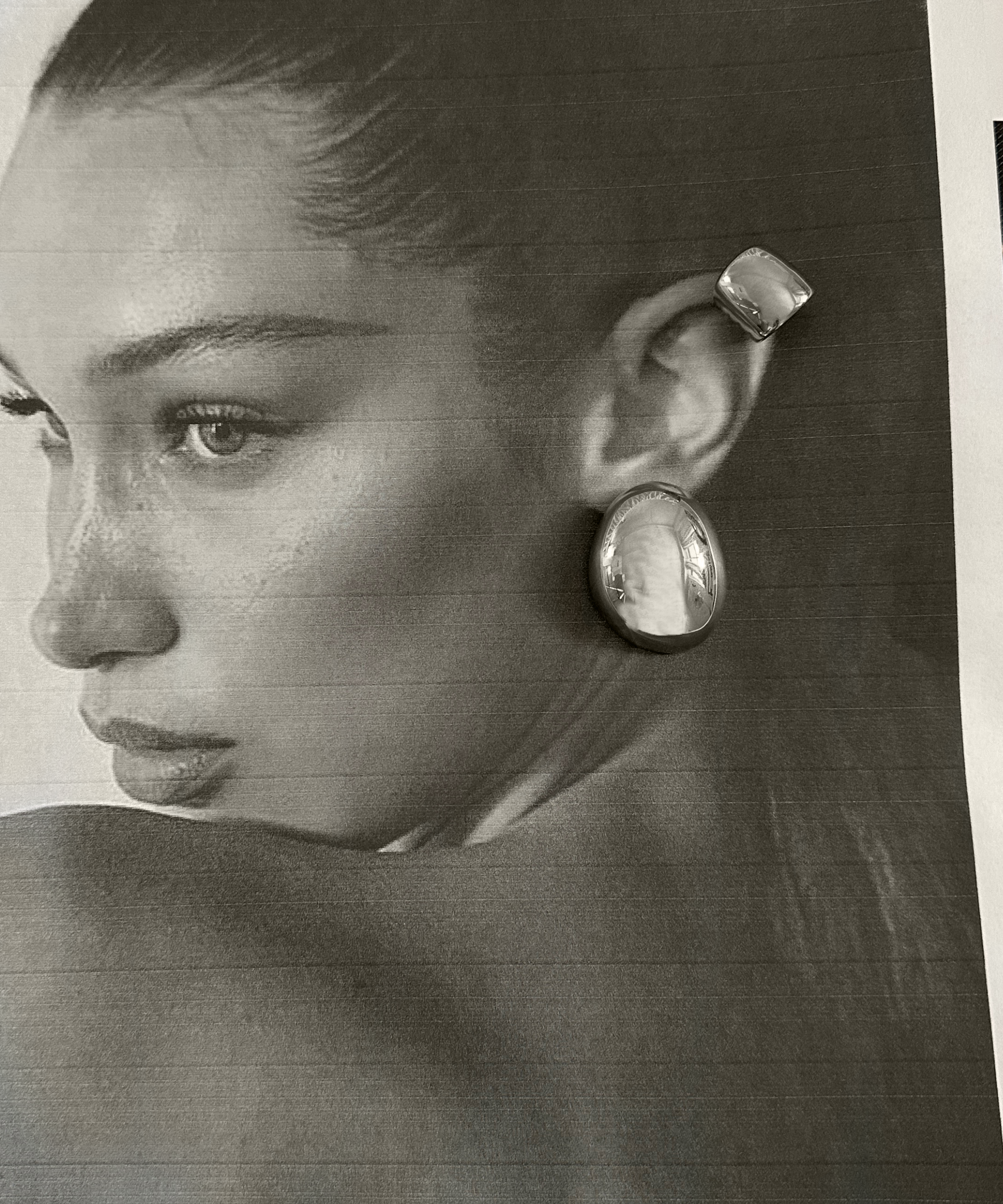 Model wearing Tala Silver Ear Cuff on cartilage, showcasing its no-pierce style