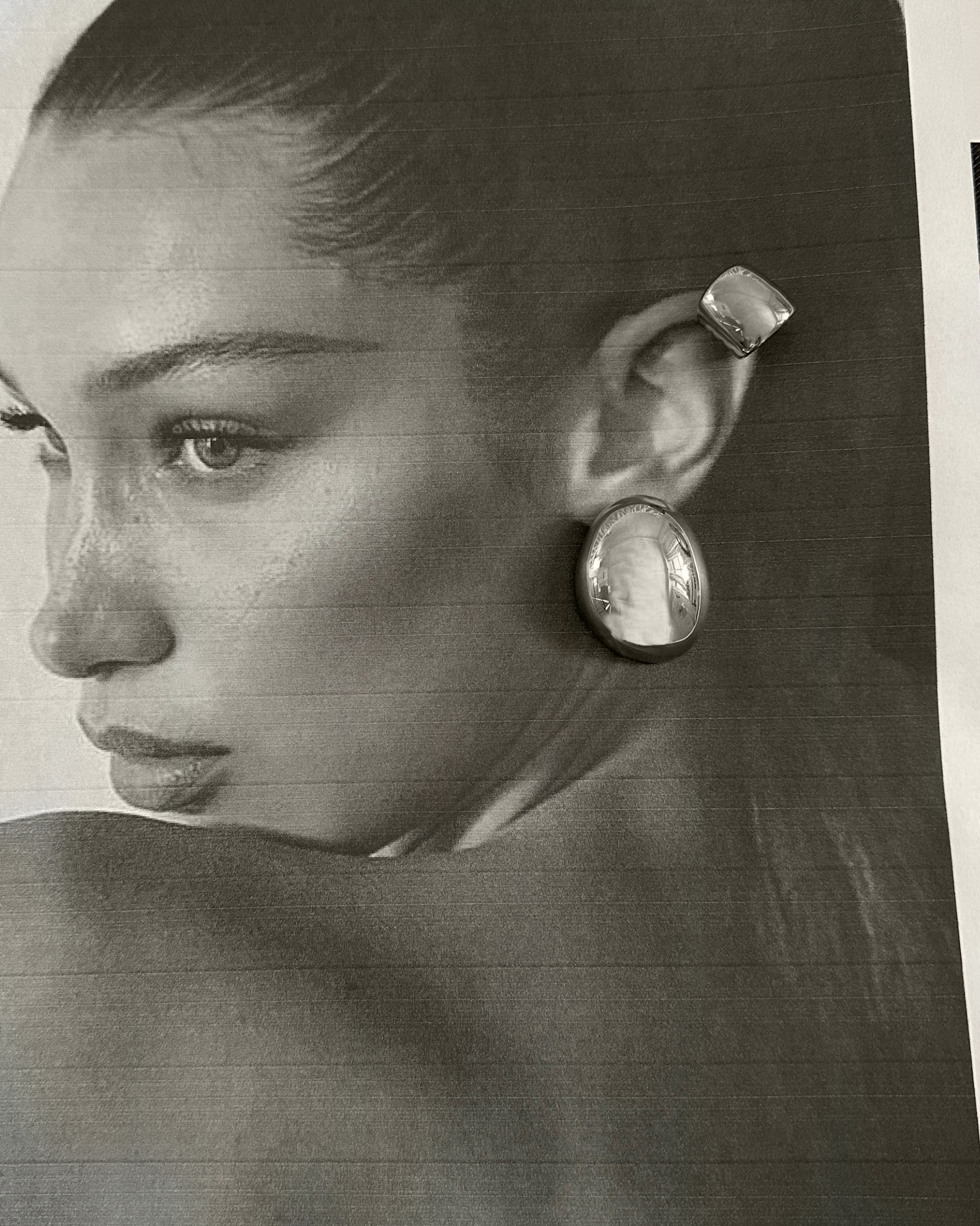 Model wearing Tala Silver Ear Cuff on cartilage, showcasing its no-pierce style