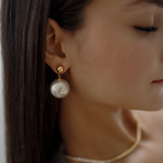 Close-up of Zaila Earrings worn, featuring elegant faux pearl drop.