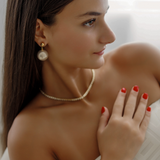 Side profile of Zaila Earrings with visible 1.5" drop length.