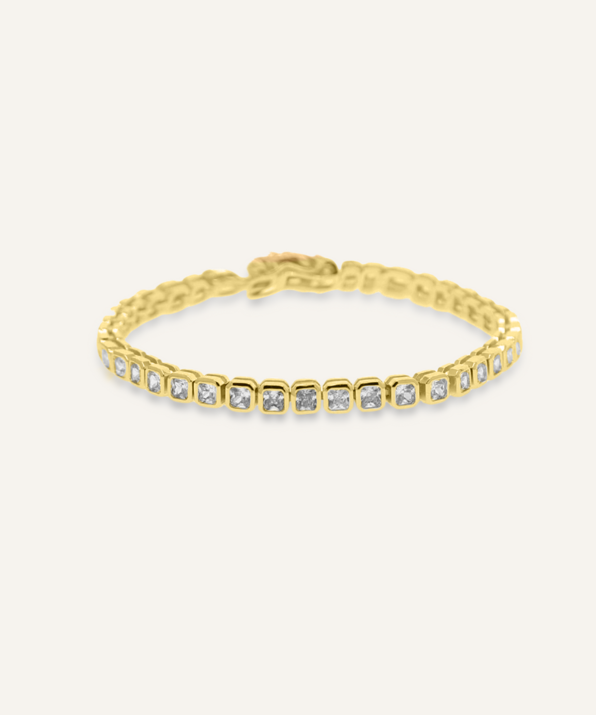 Zara Bracelet flatlay in 18K gold with square zirconia stones and tennis chain style.