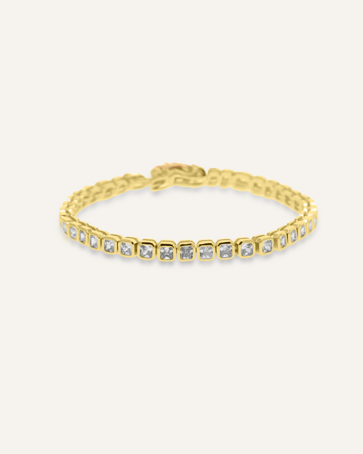 Zara Bracelet flatlay in 18K gold with square zirconia stones and tennis chain style.