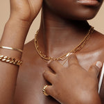 Closeup view of the Amelia Necklace worn, showcasing its delicate gold ball texture.