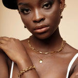 Detailed closeup of the Amelia Necklace layered on skin, highlighting its fine craftsmanship.