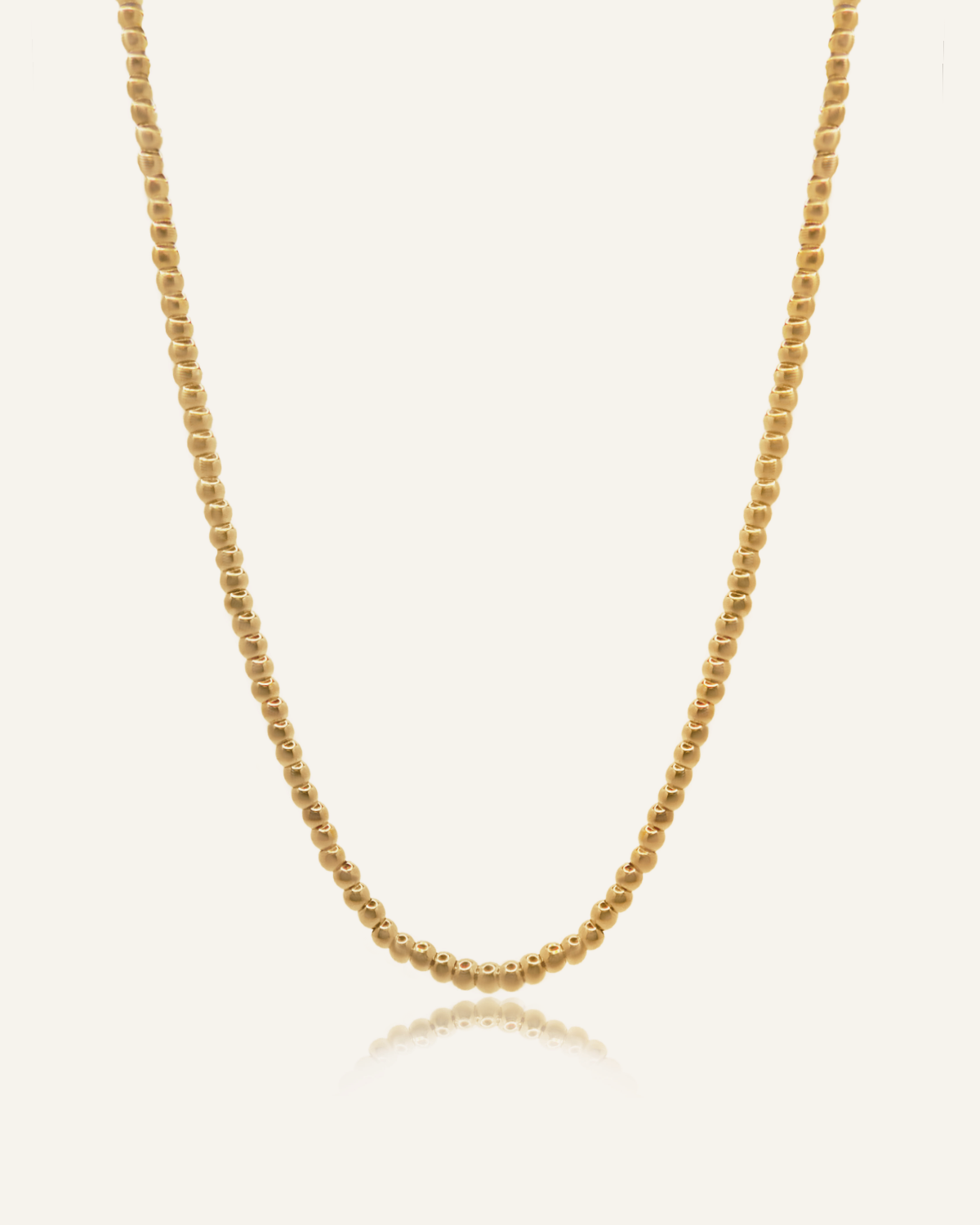 Amelia Necklace featuring a classic 18k gold-coated ball chain with lobster claw clasp.