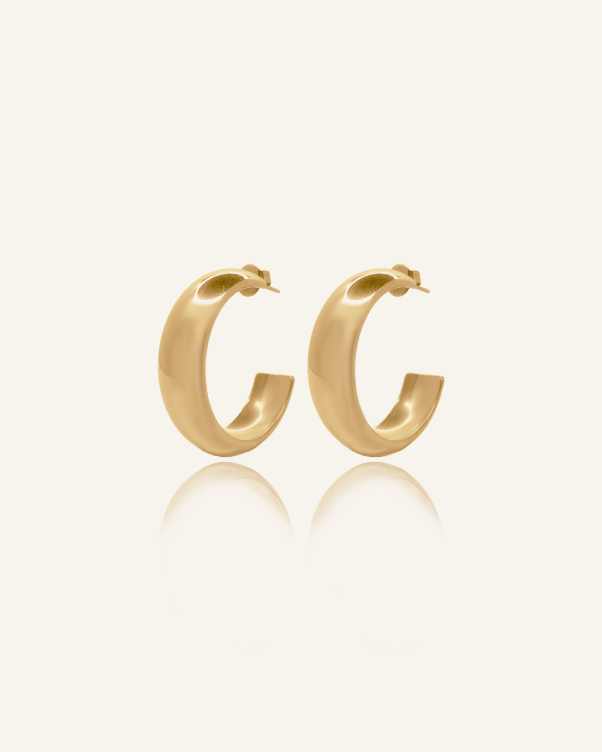 Armani Earrings flatlay showcasing 18k gold semi hoop design.