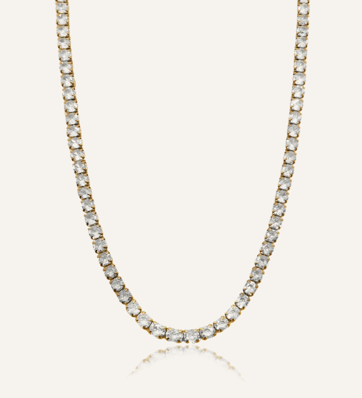 Flatlay of Astrid Necklace showing 18K gold-coated tennis chain with cubic zirconia stones.