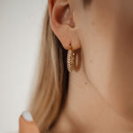 Closeup of Ayla Earrings worn, highlighting sparkling zirconia.