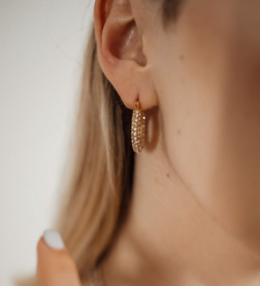 Closeup of Ayla Earrings worn, highlighting sparkling zirconia.