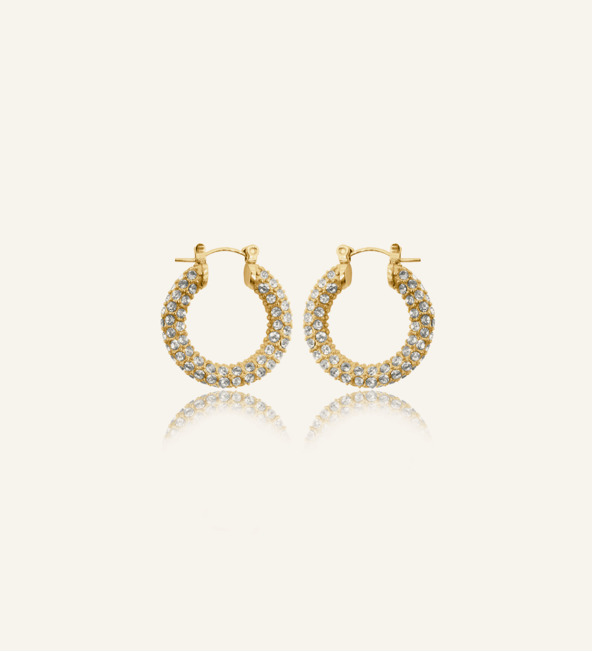 Ayla Earrings in gold pavé hoop design with cubic zirconia stones.