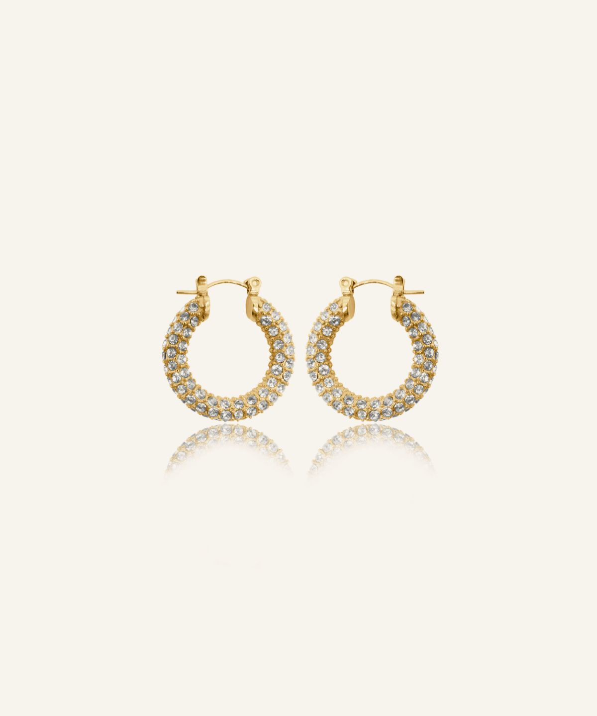 Ayla Earrings in gold pavé hoop design with cubic zirconia stones.