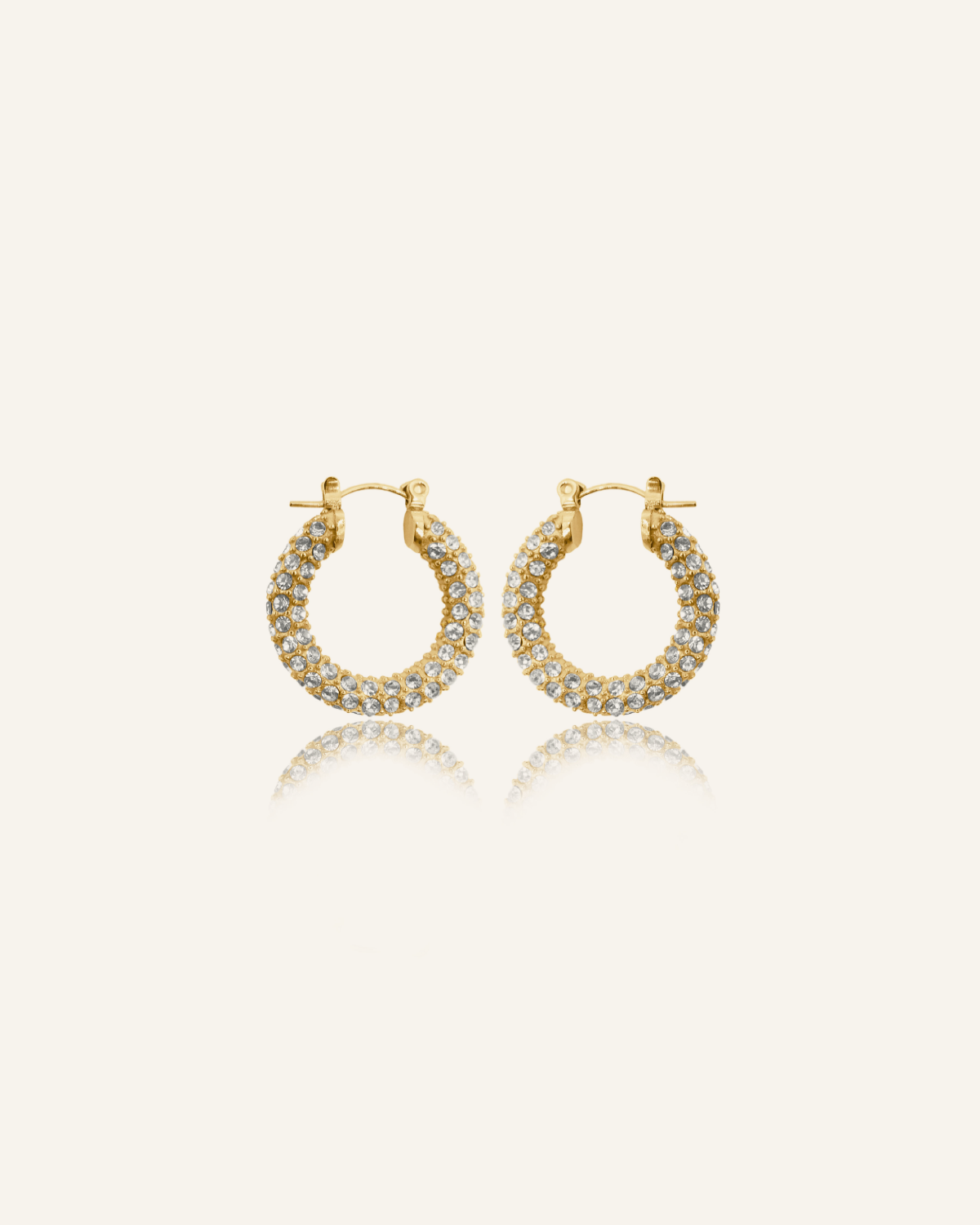 Ayla Earrings in gold pavé hoop design with cubic zirconia stones.