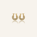 Belle Earrings featuring gold pavé hoops with cubic zirconia stones.