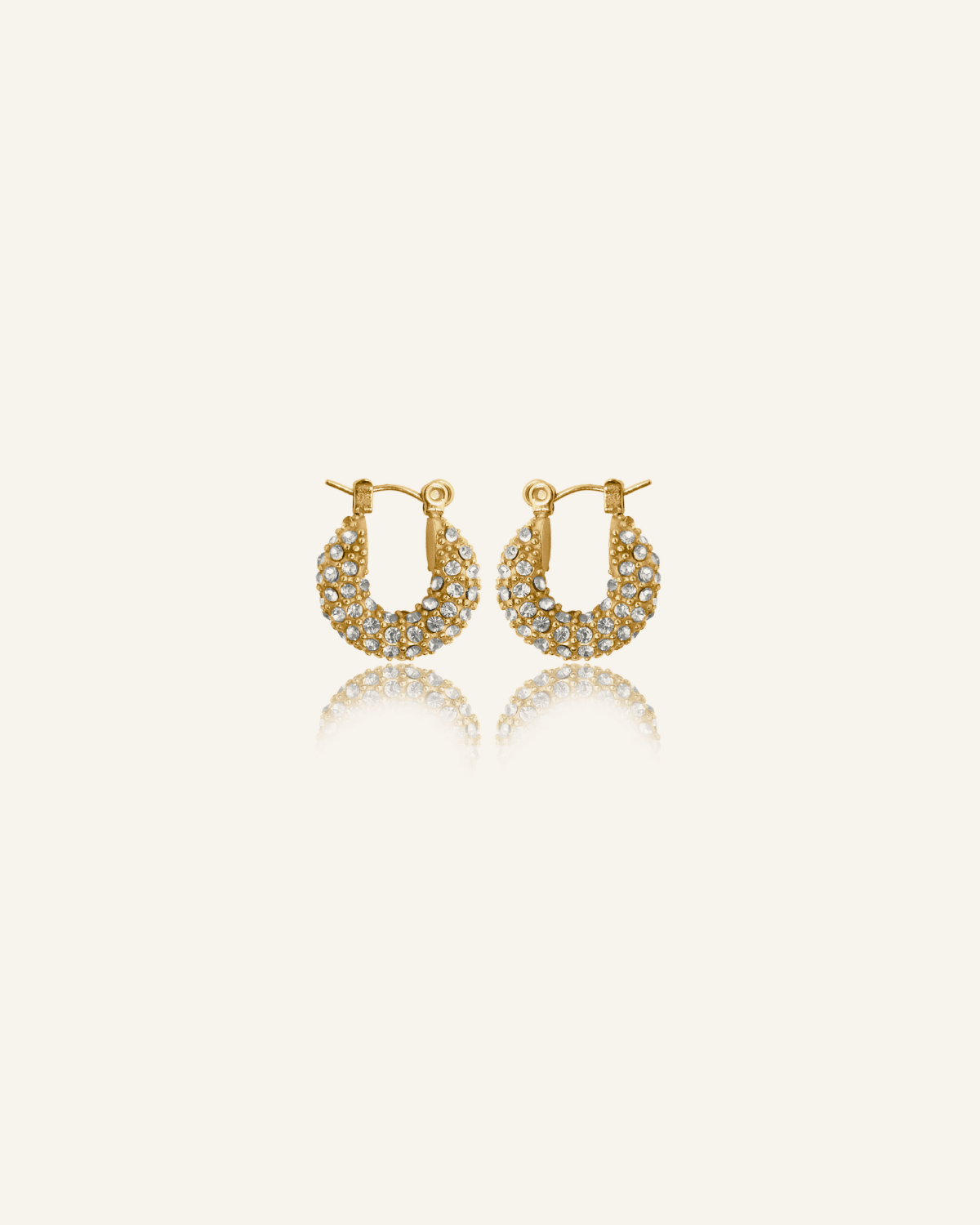 Belle Earrings featuring gold pavé hoops with cubic zirconia stones.