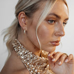 Second side view showing Belle Earrings' hoop design and shine.
