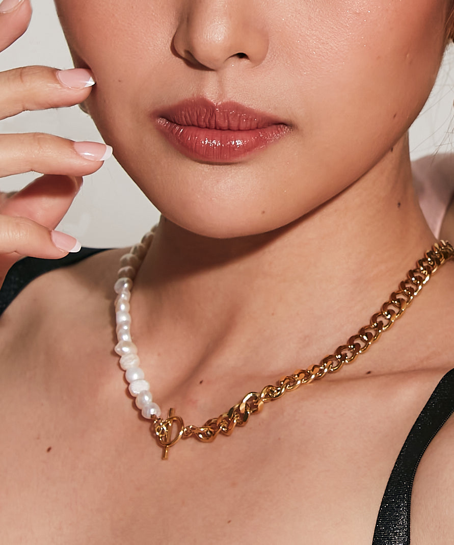 Closeup of Blanche Necklace worn on neck showing toggle closure and mixed materials.