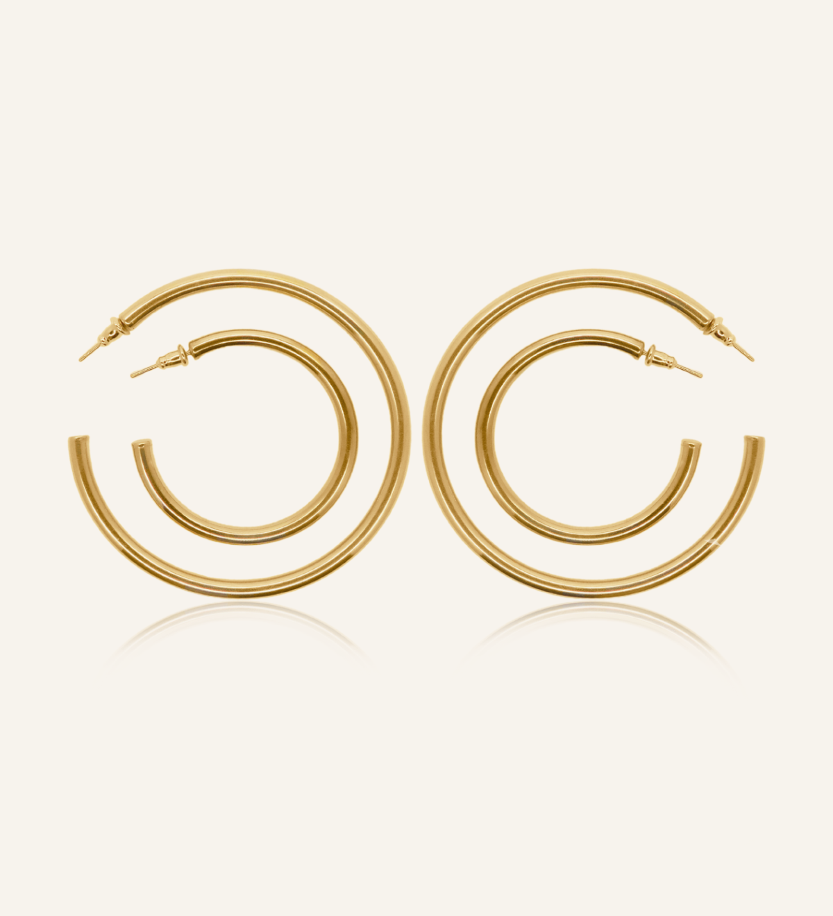 Callista gold hoop earrings in 18k coating, available in three sizes with a classic silhouette.