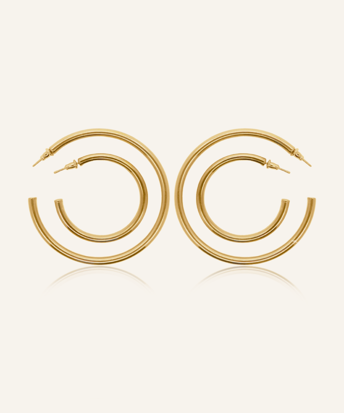Callista gold hoop earrings in 18k coating, available in three sizes with a classic silhouette.