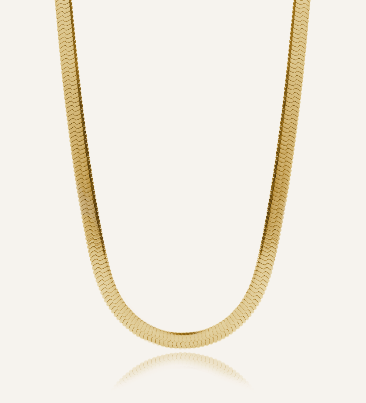 Flatlay of Capri Necklace showing its bold gold herringbone chain design.